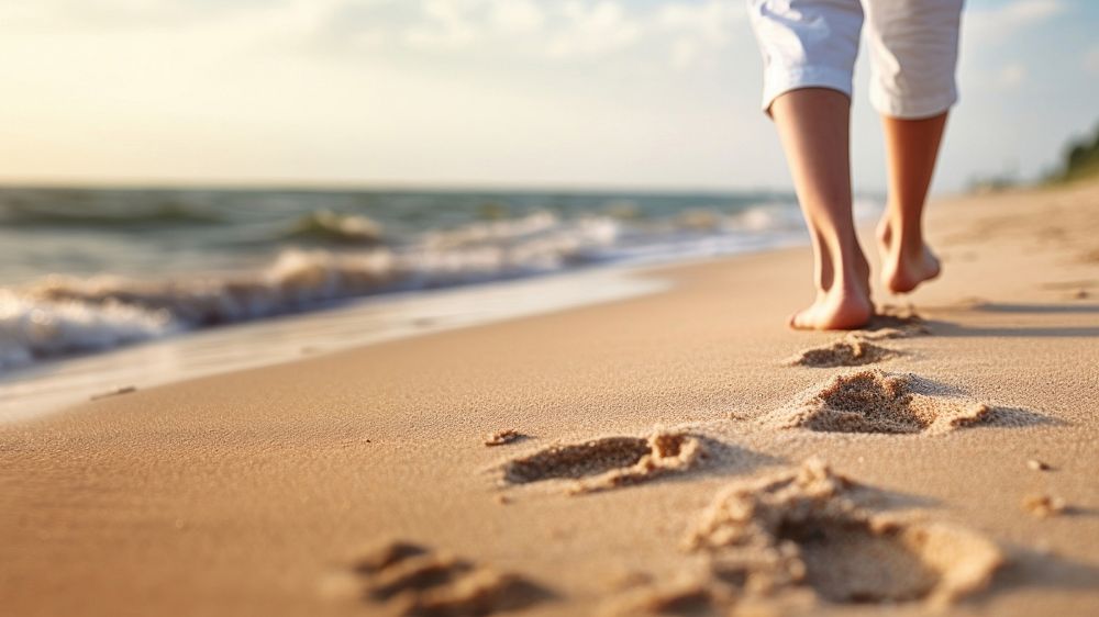 Human footsprint on sand beach in summer,. 