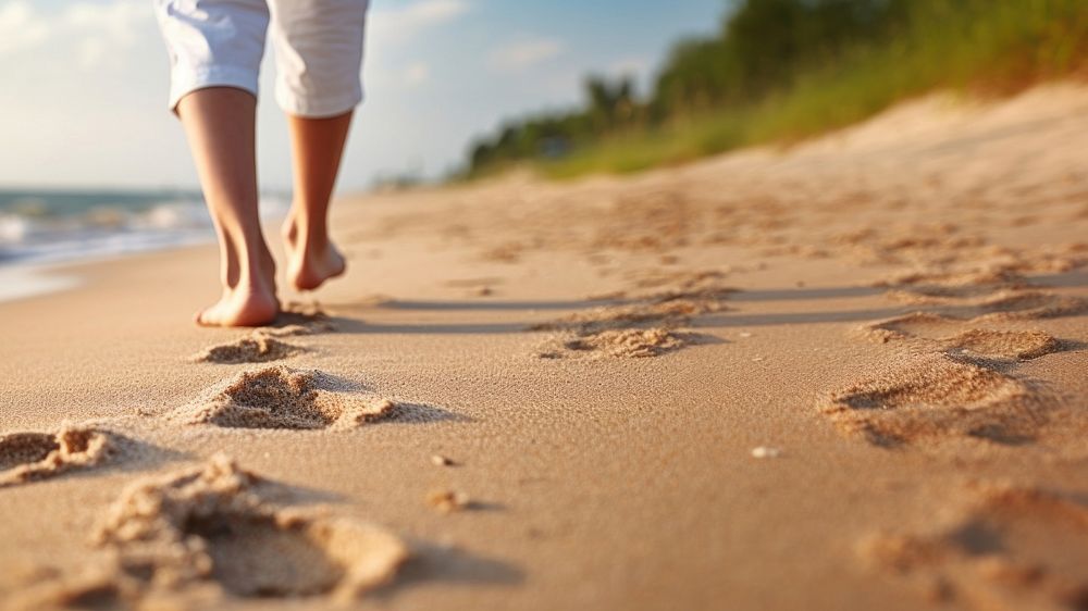 Human footsprint on sand beach in summer,. 