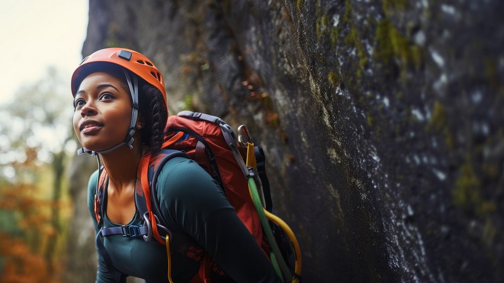 Photo of a african american female hiker go rock climbing. AI generated Image by rawpixel.