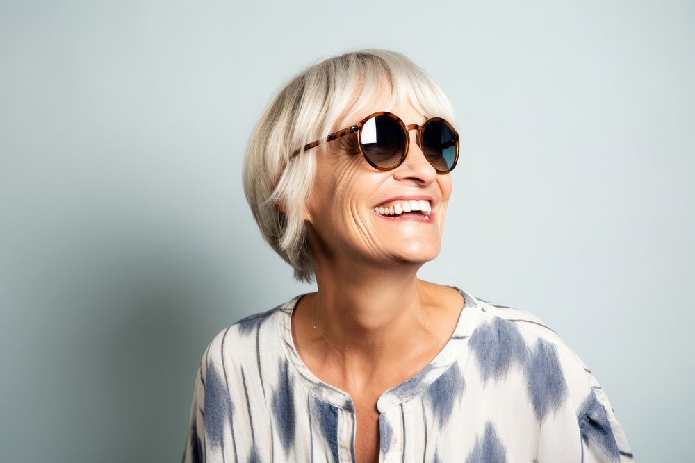 Happy mature woman sunglasses laughing portrait. AI generated Image by rawpixel.