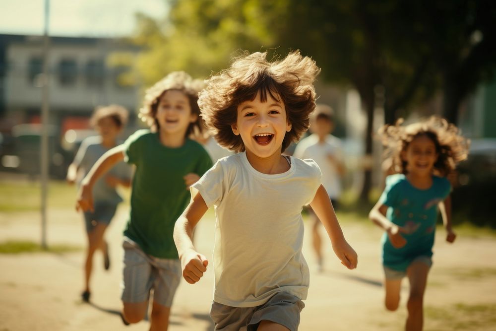 Students running laughing portrait outdoors. 