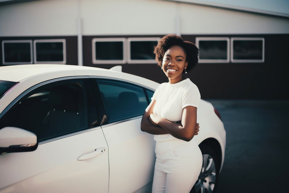 Woman standing by her car. 