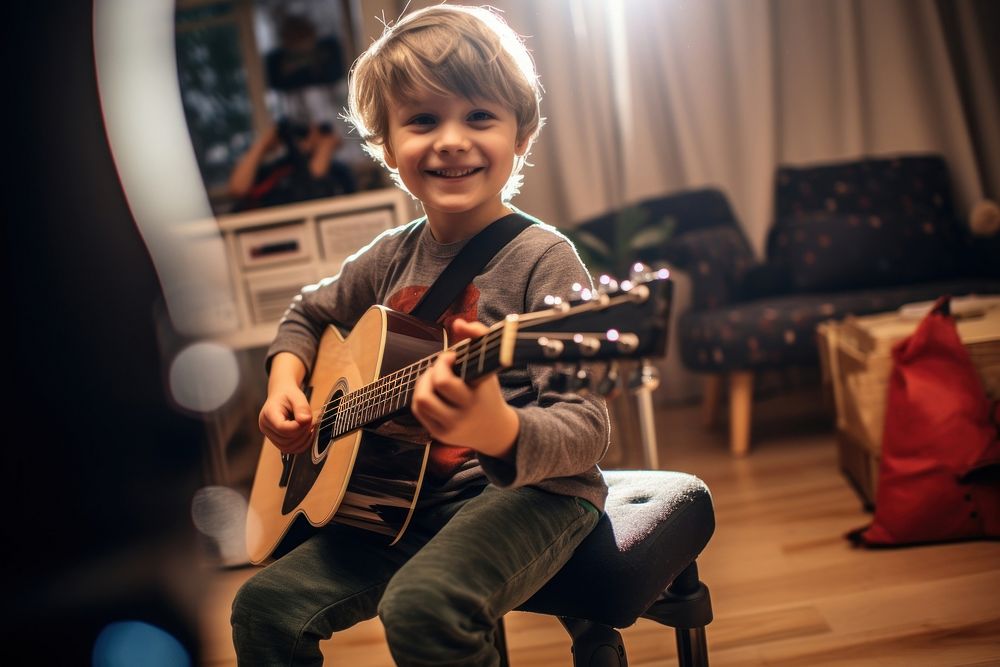 Guitar music kid playing a song. 