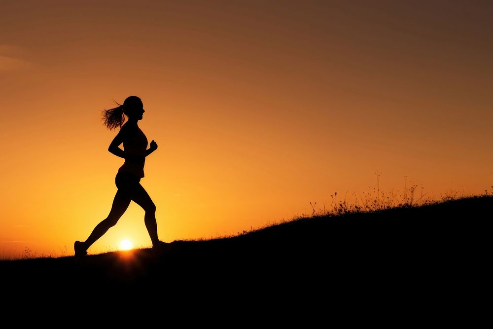 photo of silhouette woman run on the hill with sunset. AI generated Image by rawpixel.