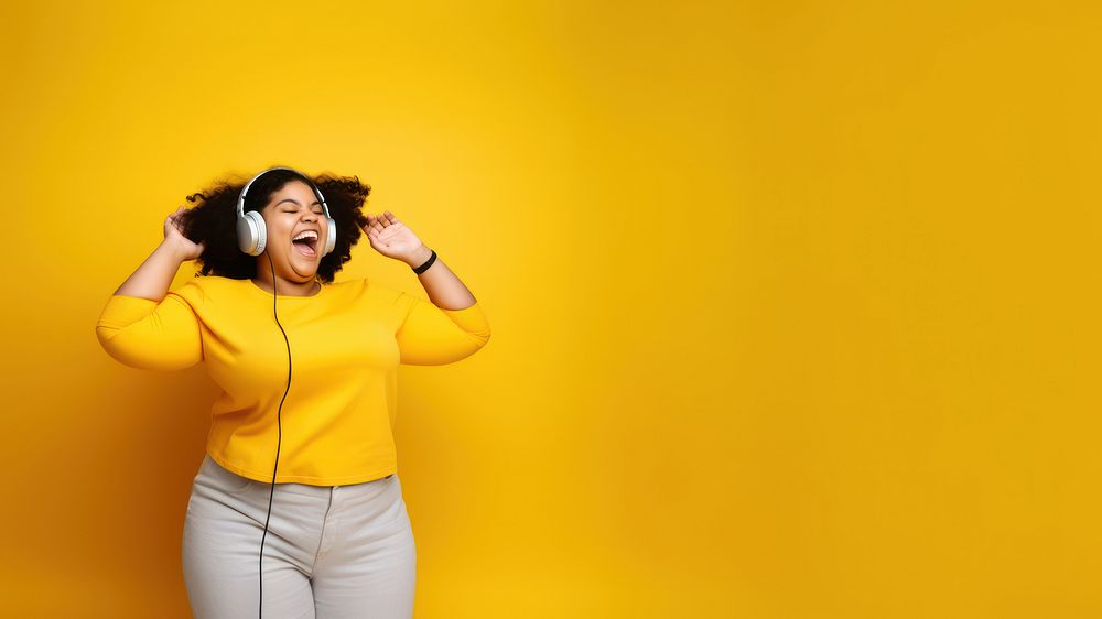 photo of a happy chubby woman wearing earphones.  