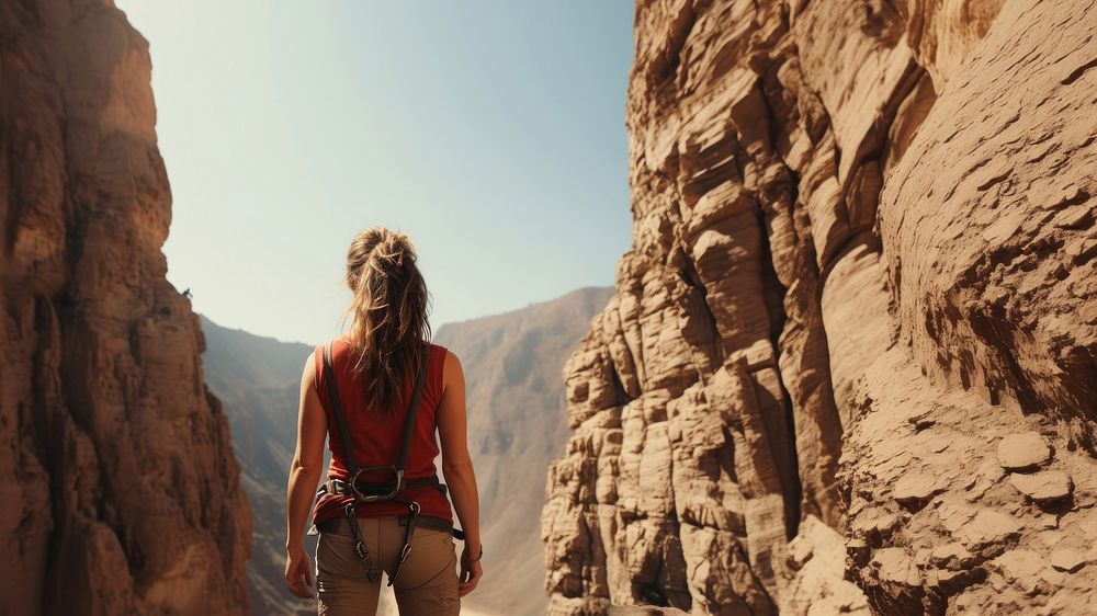 Photography of climber woman at artificial cliff.  