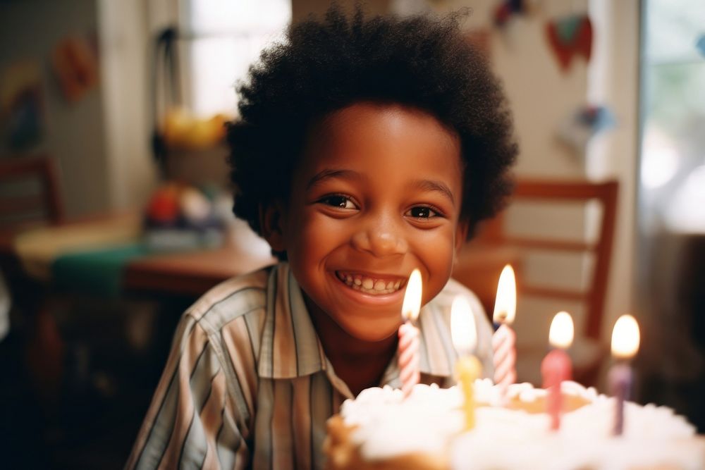 Young black boy celebrating birthday photography portrait dessert. 