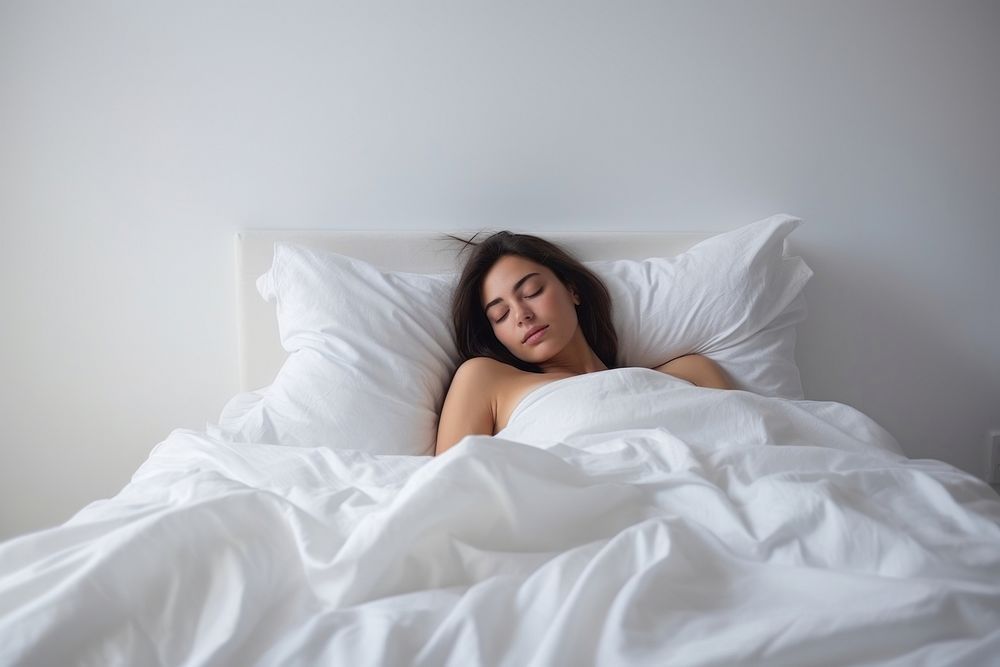 Tired woman sleeping on bed. AI generated Image by rawpixel.