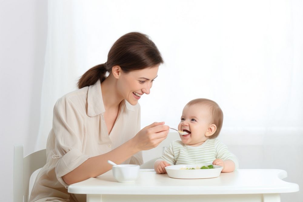 Baby eating adult spoon food. AI generated Image by rawpixel.