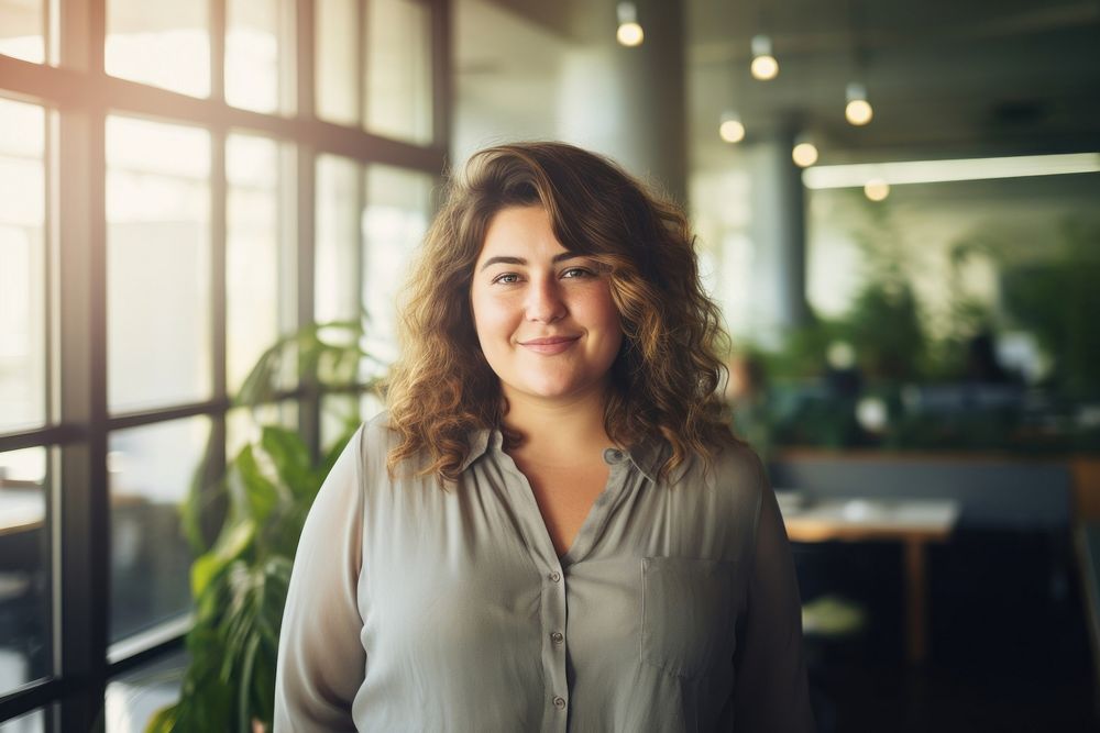 Happy chubby woman portrait standing smiling. 