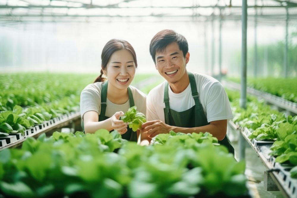 Young asian couple farmers vegetable happiness working. AI generated Image by rawpixel.