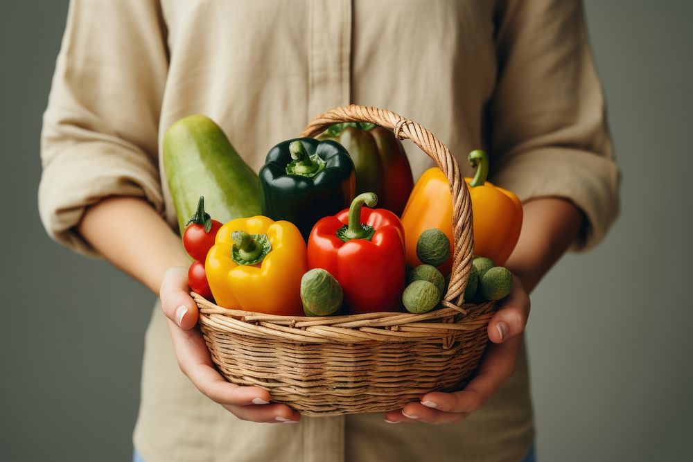 Woman holding vegetables basket fruit plant food. 