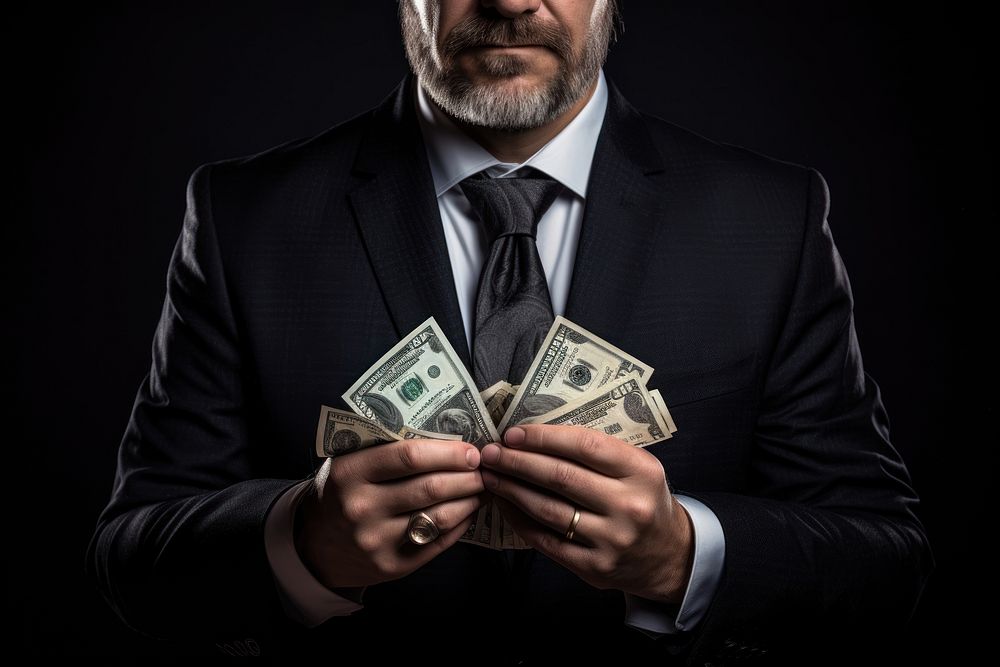 Man holding dollar money. AI generated Image by rawpixel.