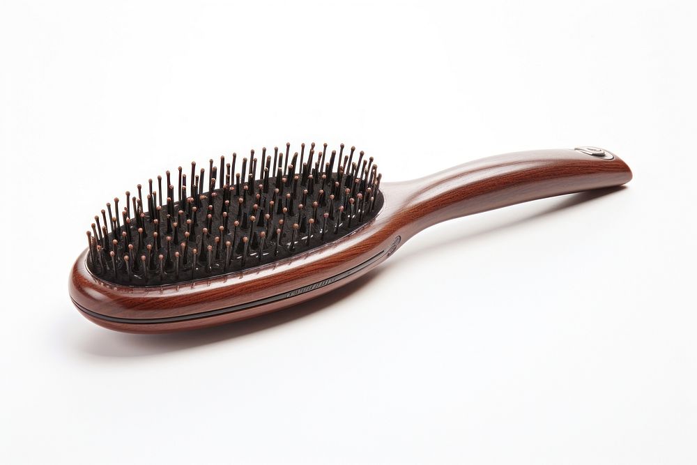 A hairbrush tool white background eyelash. AI generated Image by rawpixel.