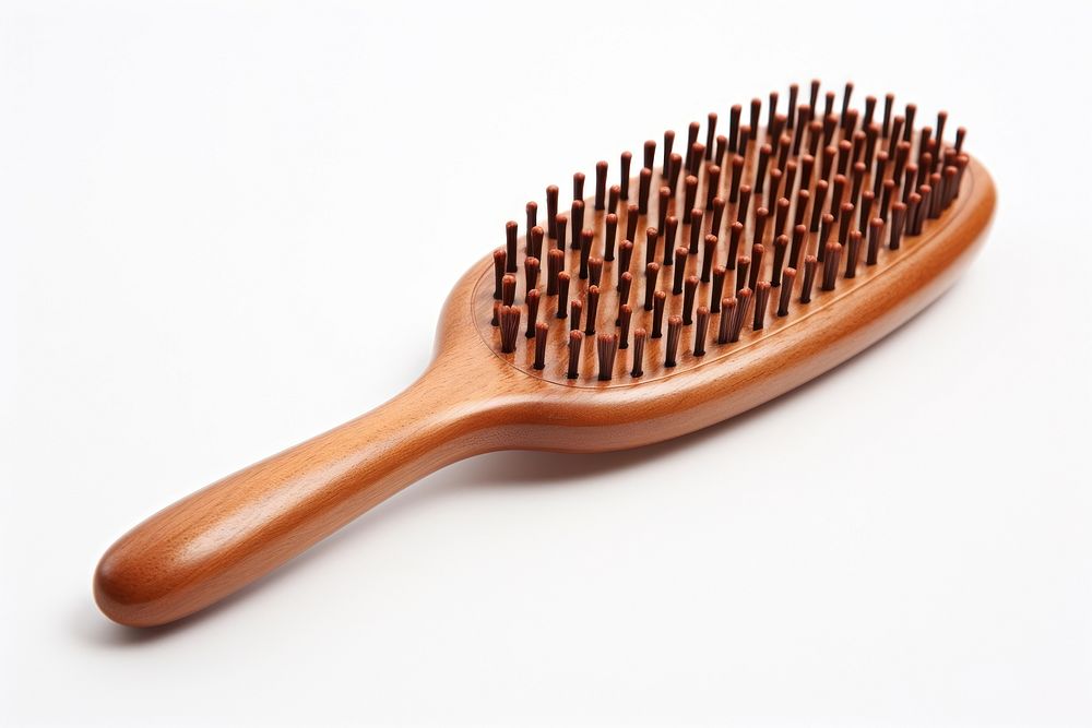 A hairbrush tool white background simplicity. AI generated Image by rawpixel.