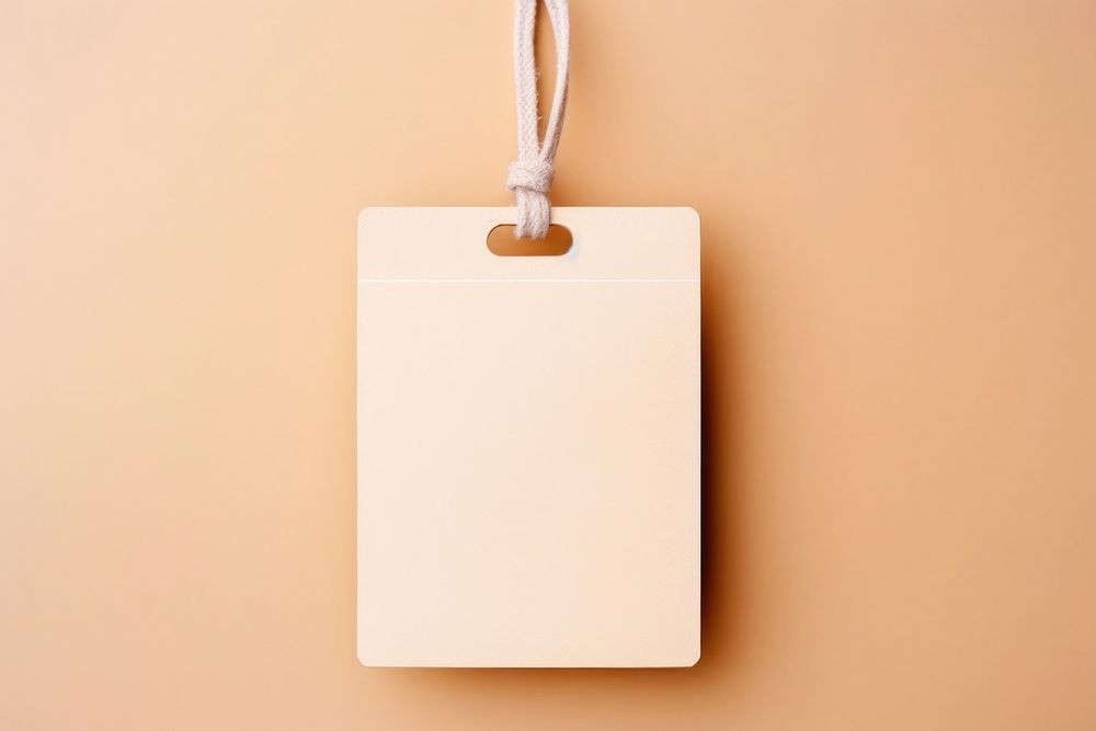 Blank craft paper label hanging accessories electronics. AI generated Image by rawpixel.
