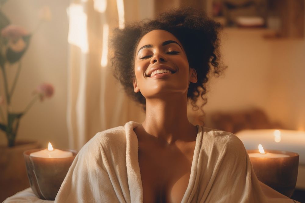 Black woman enjoying a body massage adult smile spa. AI generated Image by rawpixel.