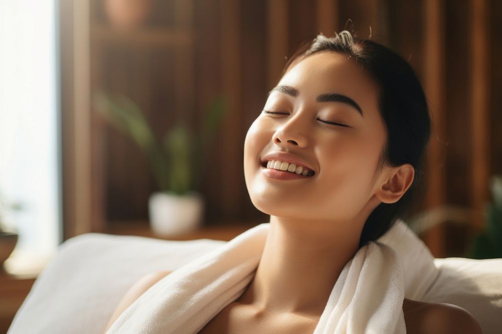 Asian women enjoying a body massage adult spa contemplation. AI generated Image by rawpixel.