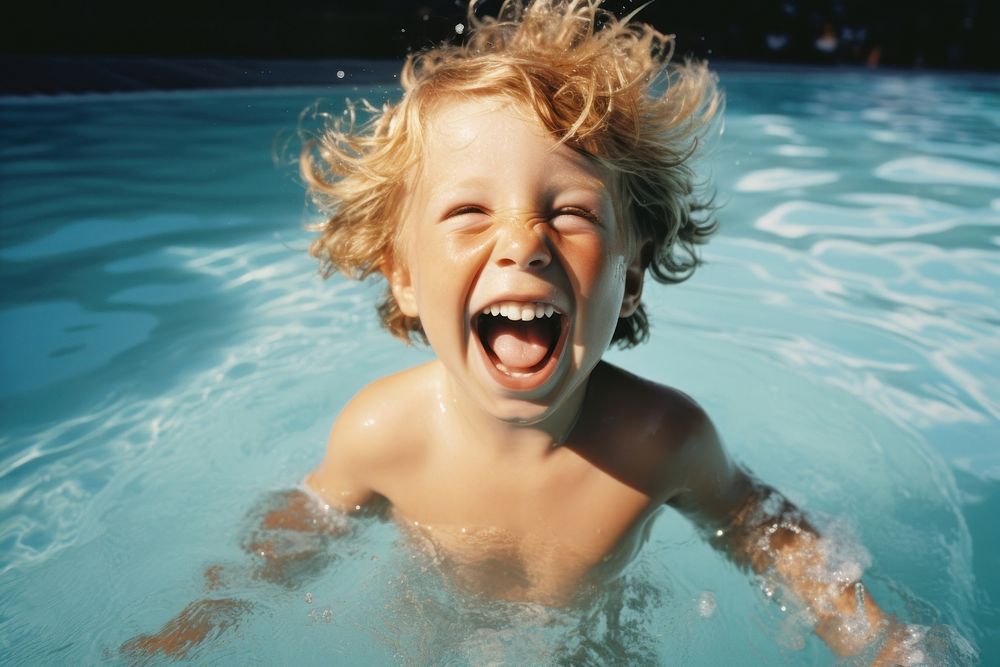 Kid swimming laughing portrait. 