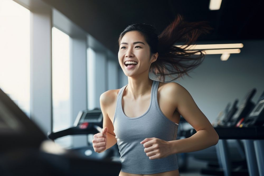 Happy asian woman treadmill running smile. AI generated Image by rawpixel.