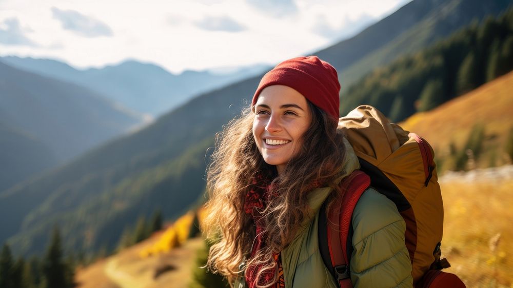 Photo of happy smiling woman hiking in mountains. AI generated Image by rawpixel. 