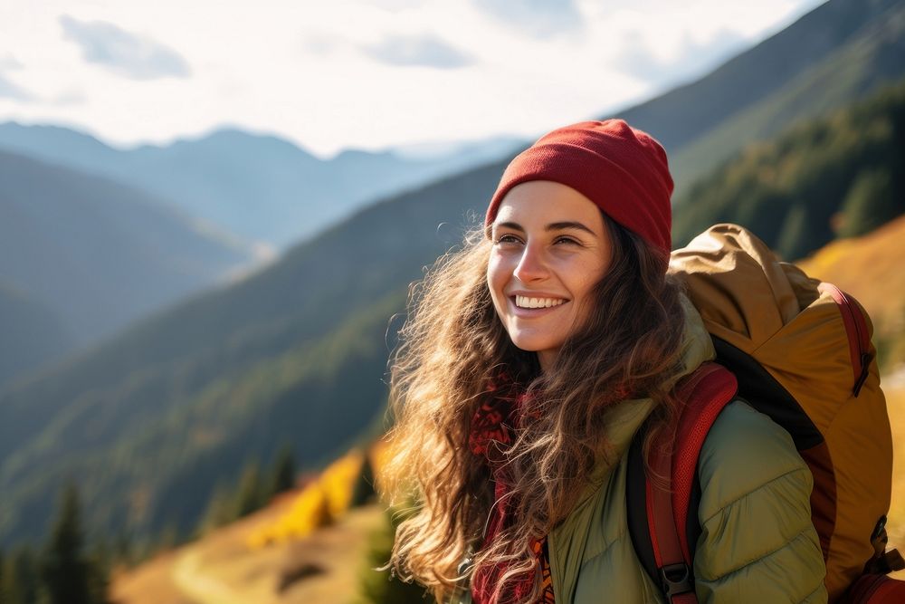 Photo of happy smiling woman hiking in mountains.  