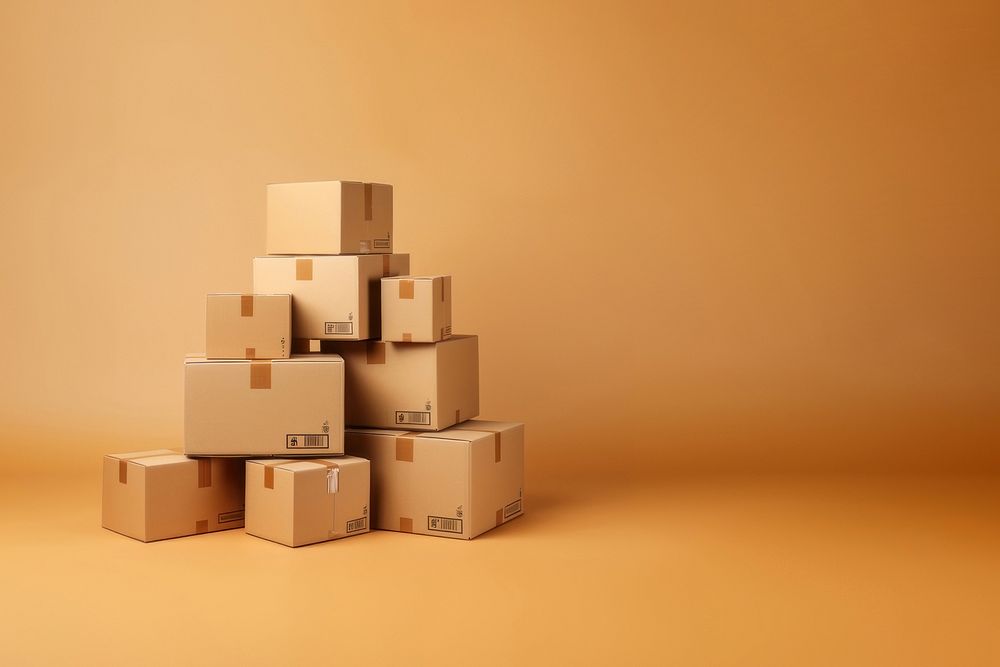 Photo of stacked moving boxes, isolated on beige background.  