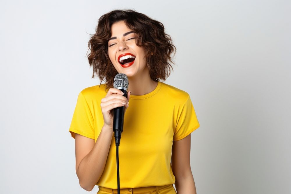 Singing microphone laughing holding. 