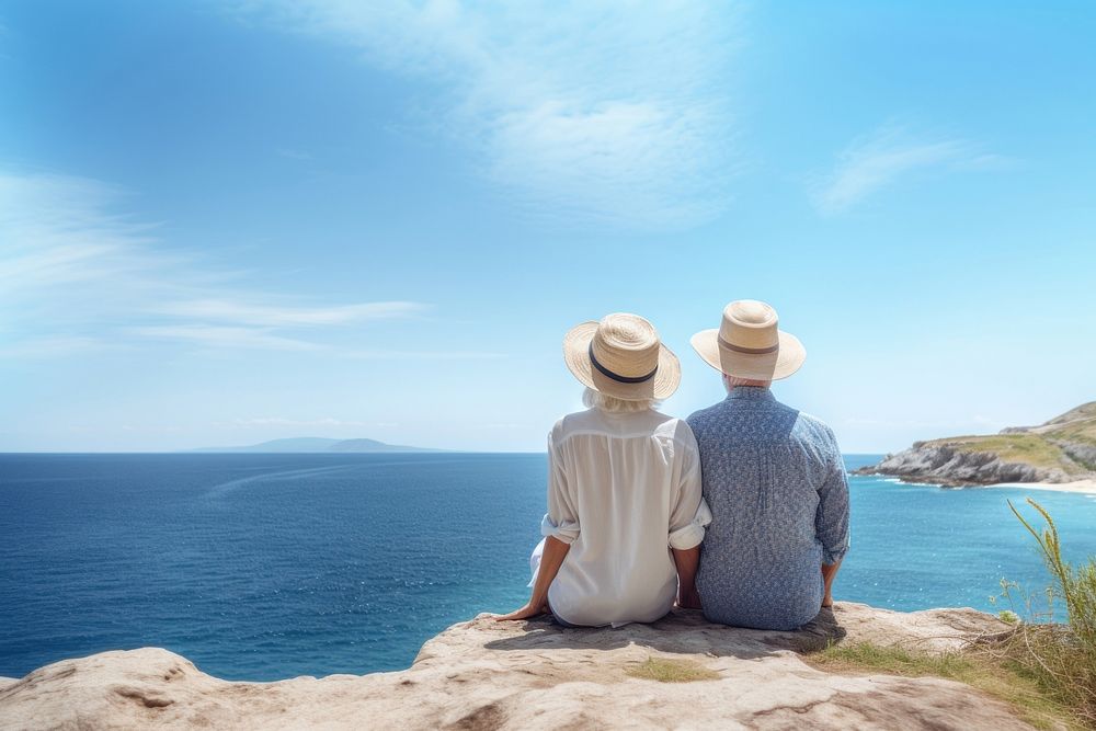 Traveler senior couple look at the sea. AI generated Image by rawpixel. 