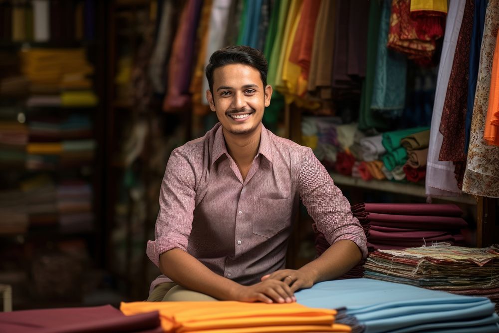 Indian Cloth merchant smiling sitting adult. AI generated Image by rawpixel.