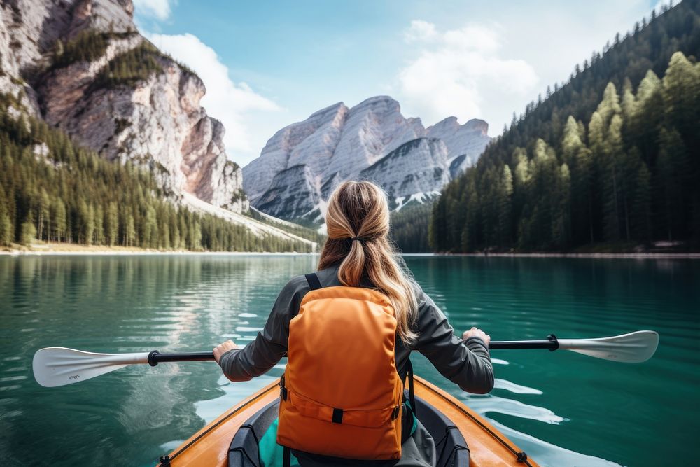 Young woman kayaking recreation lifejacket mountain. AI generated Image by rawpixel.