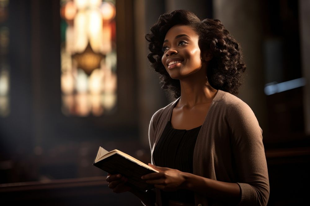 A dark-skinned woman holding a Bible reading adult contemplation. AI generated Image by rawpixel.