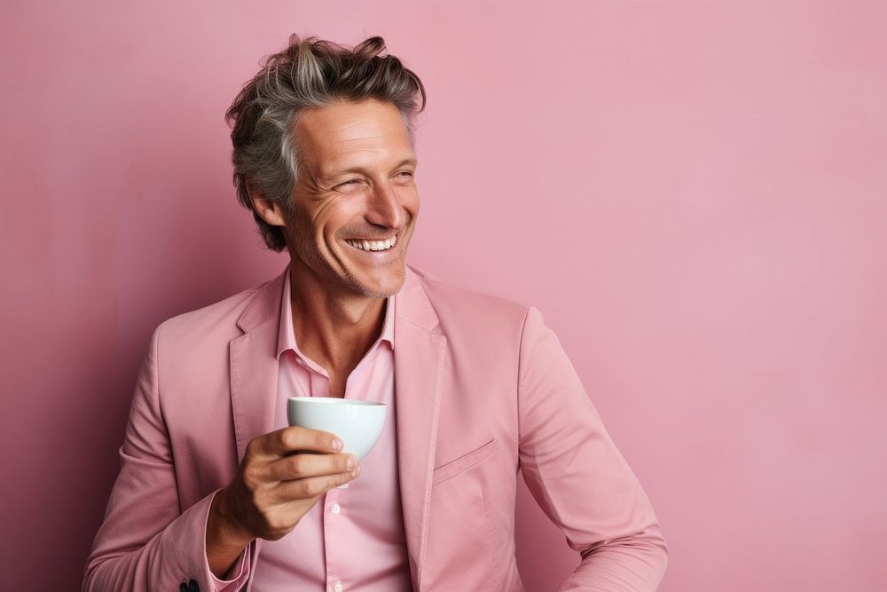 Man drinking tea laughing smiling coffee. 