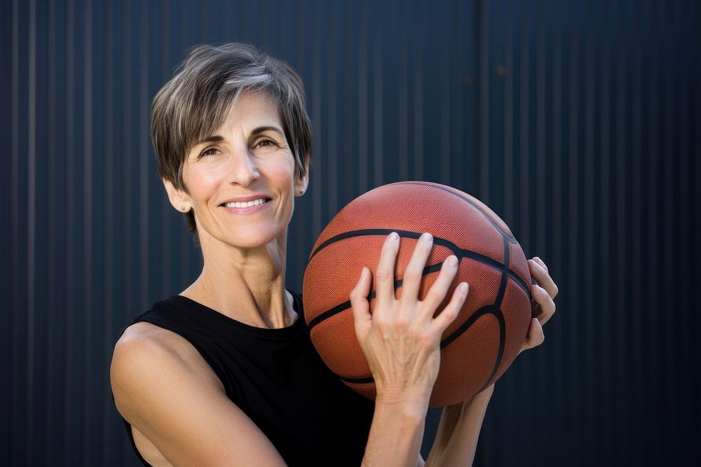 Woman holding basketball sports smile gym. AI generated Image by rawpixel.