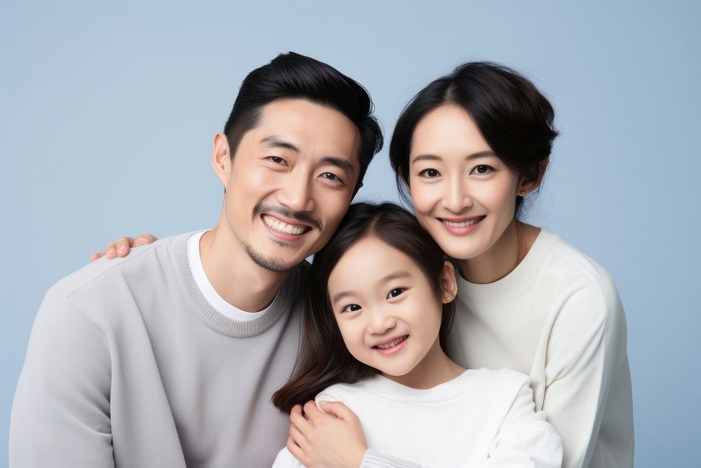 Asian family smiling adult blue. AI generated Image by rawpixel.