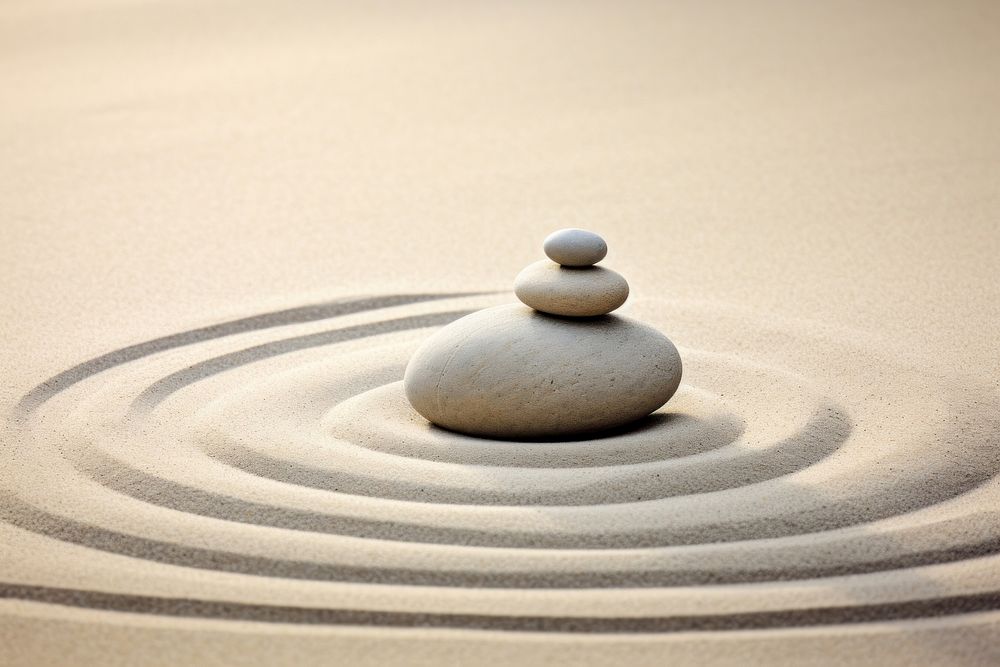Zen stones on sand photo. AI generated image by rawpixel.