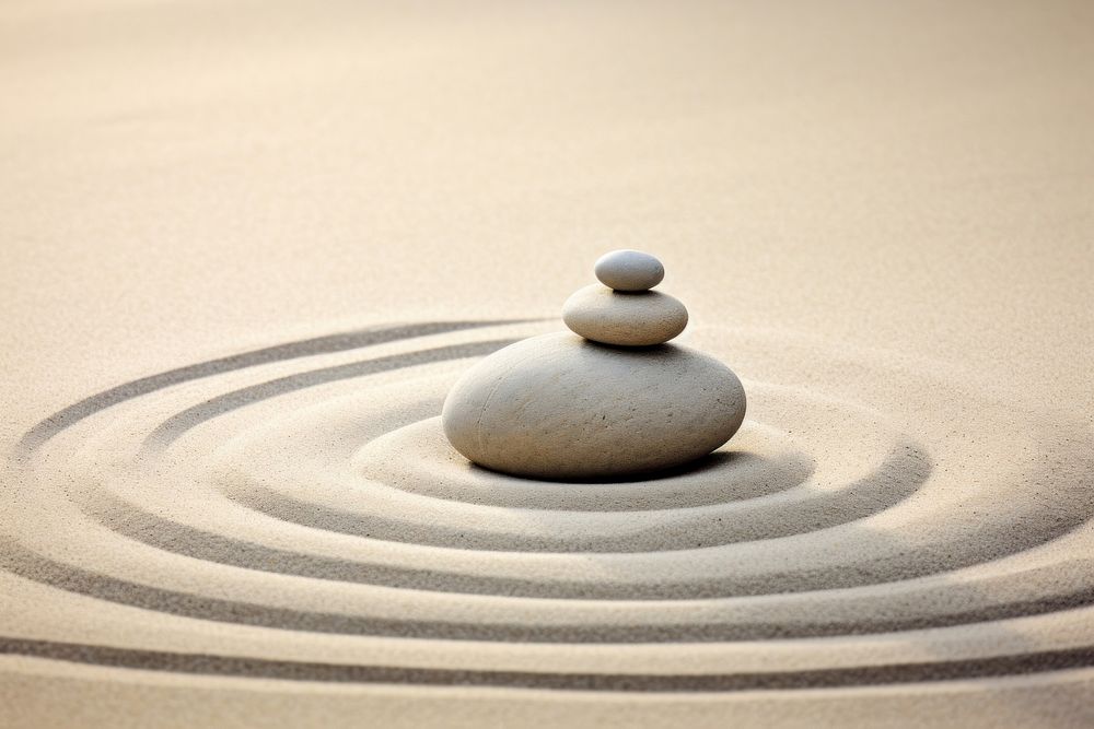 Zen stones on sand photo. 