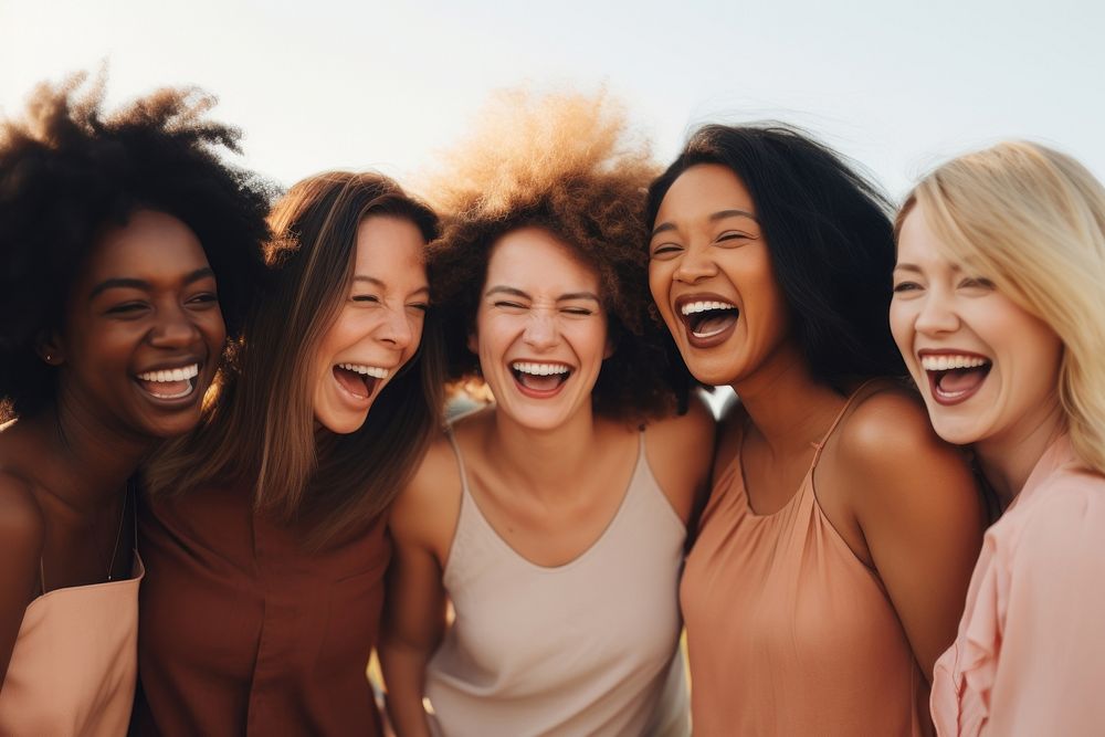 Different race women laughing adult togetherness. 