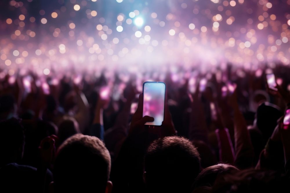 Concert party audience holding. AI generated Image by rawpixel.