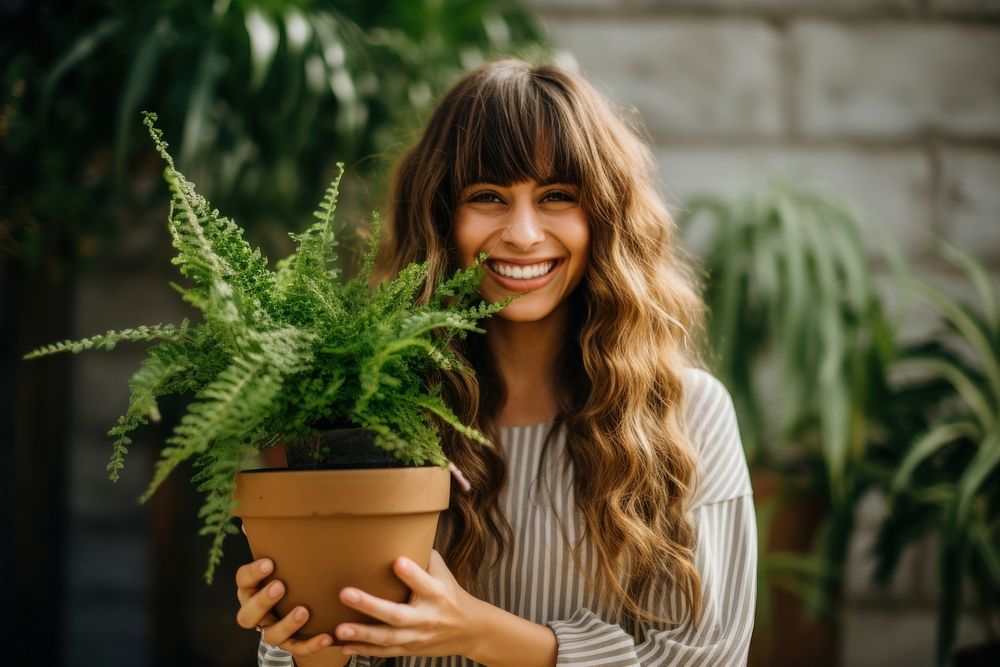 Happy woman with potted plant. AI generated Image by rawpixel.