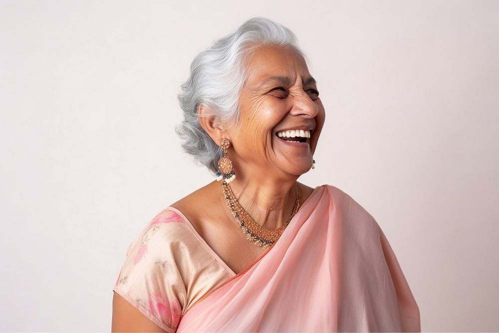 Old indian woman wearing traditional outfit smiling necklace laughing jewelry. 