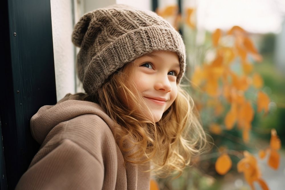 Caucasian girl kid wearing autumn knitted outfit smiling smile contemplation architecture. AI generated Image by rawpixel.