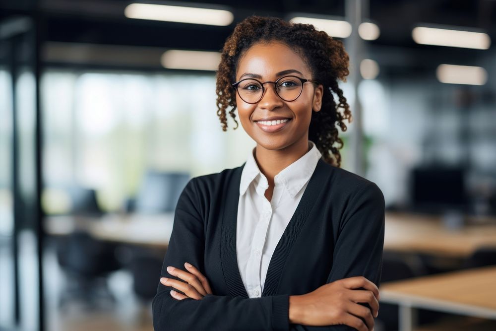 Black woman smiling crossing arms glasses office adult. AI generated Image by rawpixel.