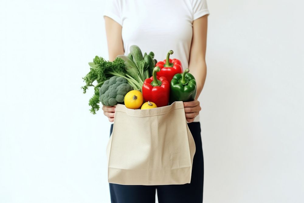 Cloth bag vegetable holding adult. AI generated Image by rawpixel.