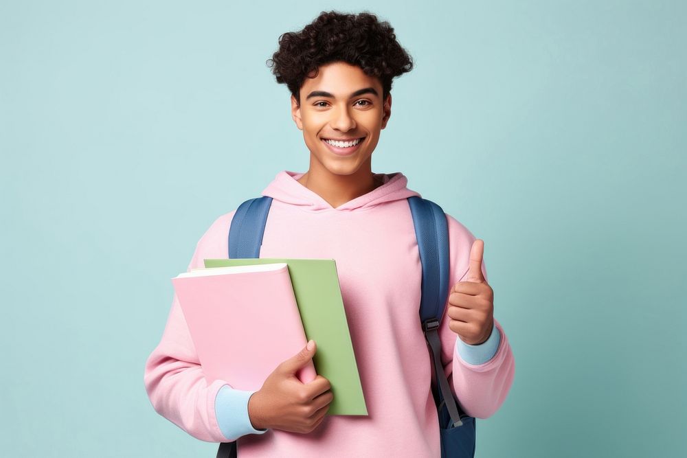 Young man holding books, college student. AI generated Image by rawpixel.