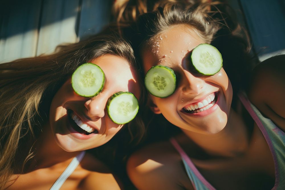Two girls make homemade face cucumber photography freshness. AI generated Image by rawpixel.