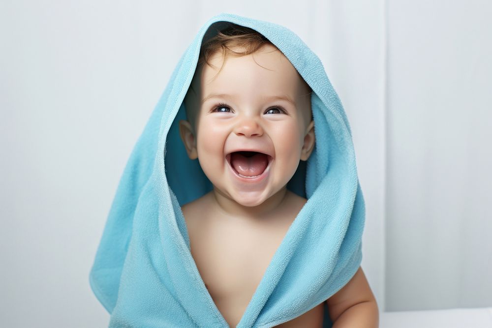 Baby laughing towel happy. 