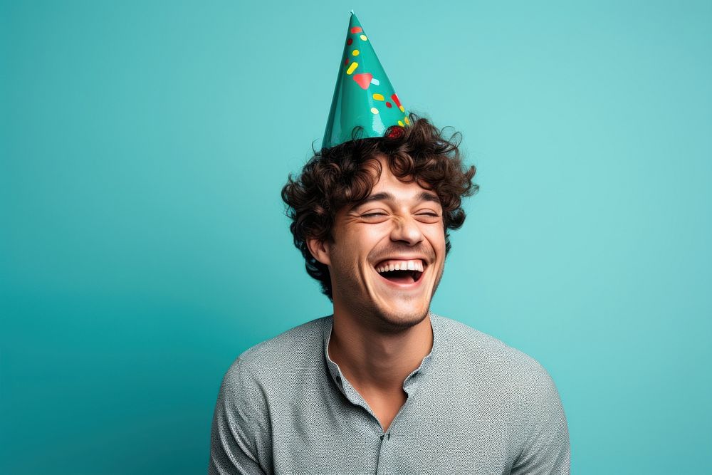 Man wearing party hat laughing adult celebration. AI generated Image by rawpixel.