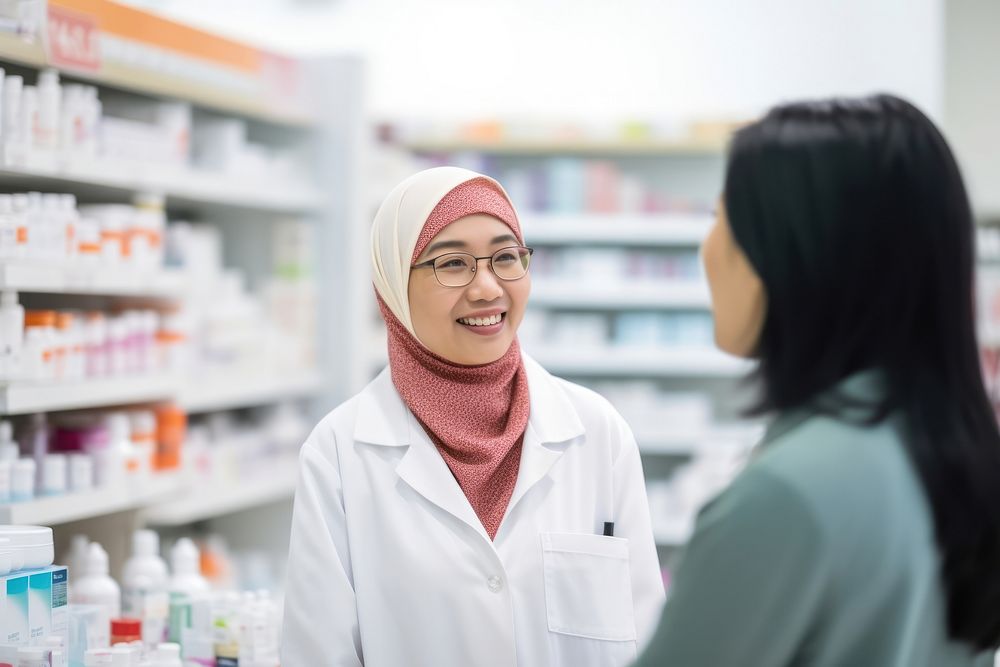 Asian middle age female pharmacist customer pharmacy medicine. AI generated Image by rawpixel.