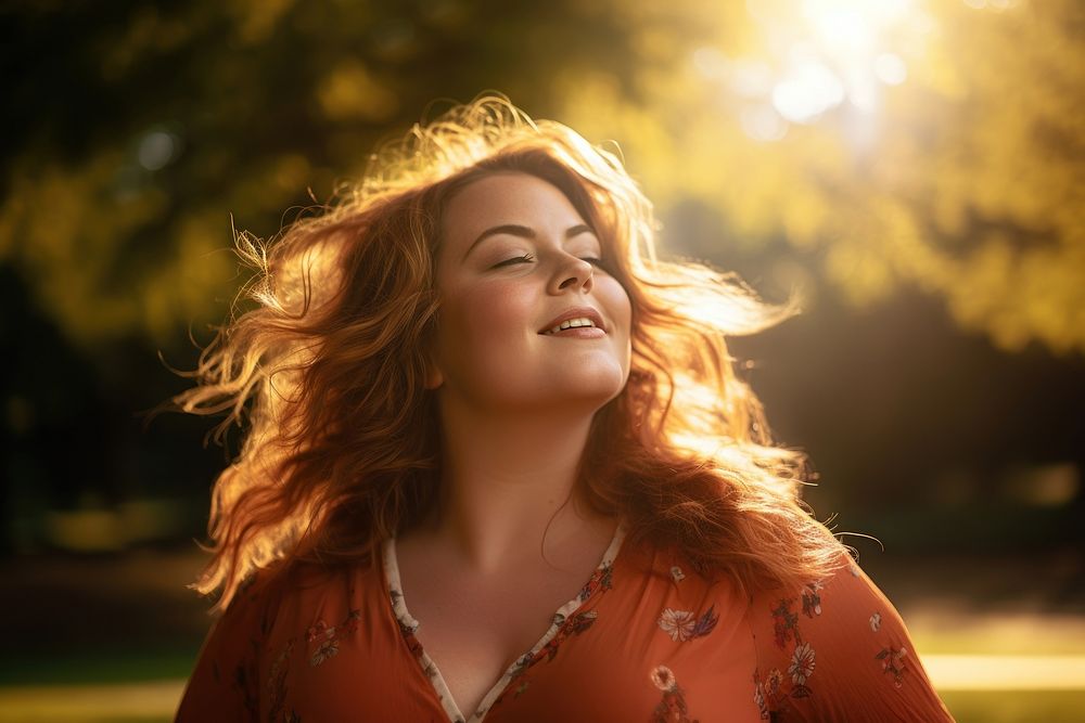 Relaxed woman laughing portrait outdoors. 